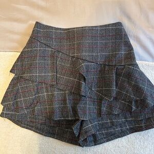 Black, grey, and red plaid skort